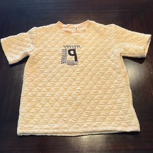 Bubbly Cream T-shirt with black embroidered letters